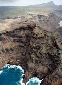 The sheer volcanic rock face of the island of St Helena