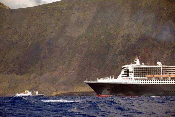 Dwarfed: RMS St Helena meets the Queen Mary 2